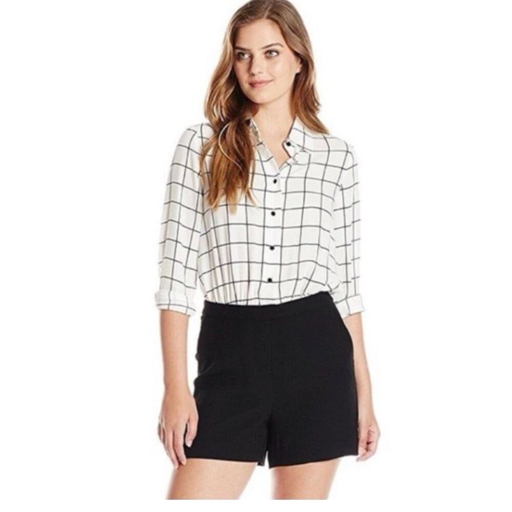 Vince Camuto romper with black and white long sleeve checked top and black botto